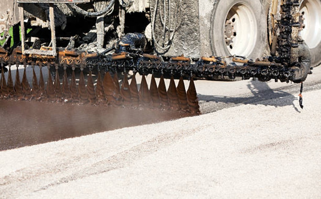 Asphalt chip sealing and road surface maintenance