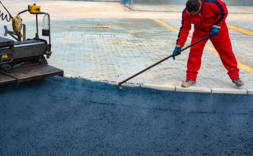 Asphalt paving process on a road construction project.
