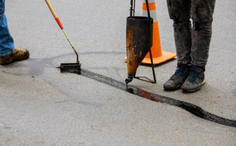 Asphalt crack sealing on road surface restoration work
