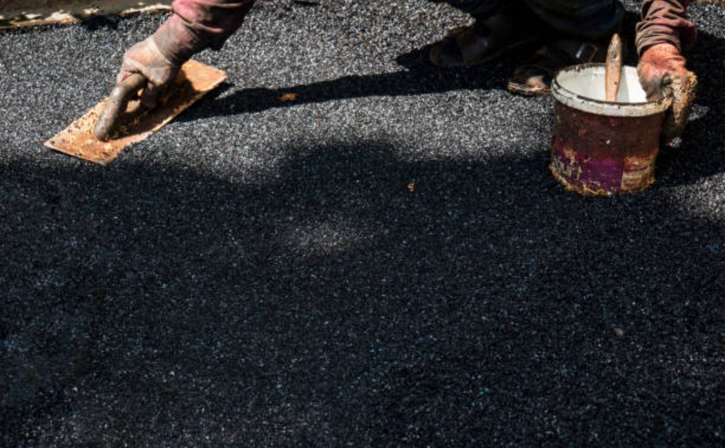 Professional asphalt road repair by Jim’s Paving & Chip Sealing