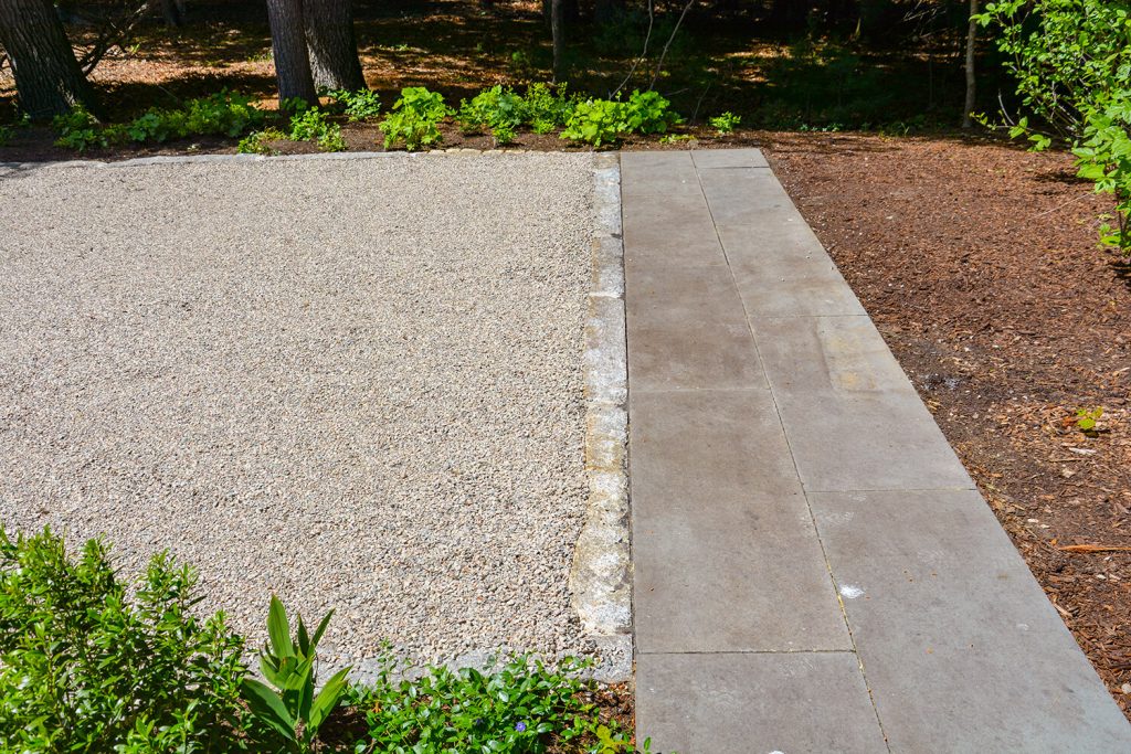 Chip Seal Driveway Services creating a durable, attractive surface with a clean and well-defined driveway finish.