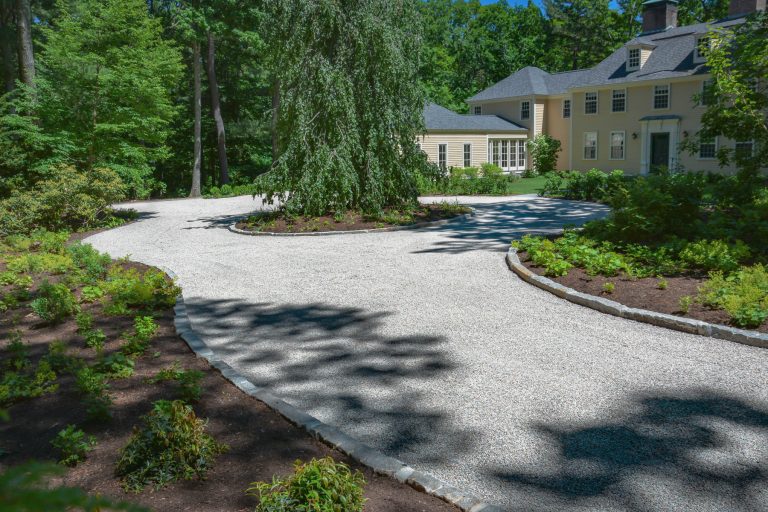 Chip Seal Driveway Services creating a durable, attractive driveway with a clean finish that enhances the home's curb appeal.