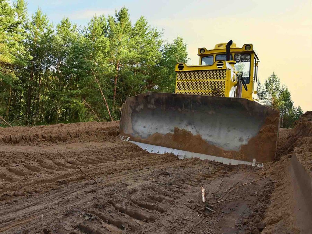 Expert Grading Service for Construction Site Expert Grading Service using a bulldozer to shape and level land for strong, construction-ready foundations.