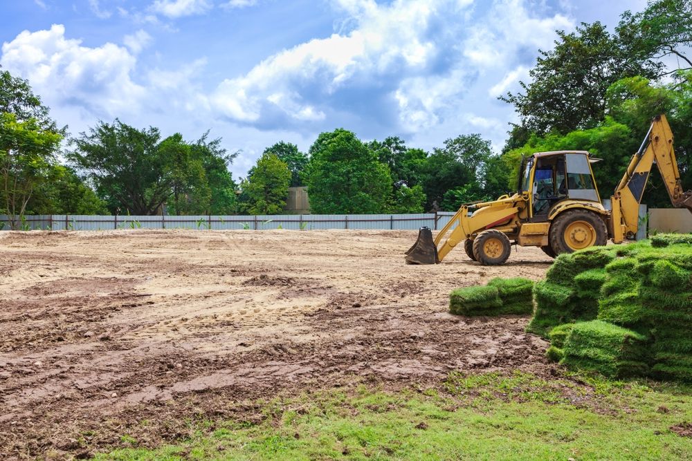 Professional Grading for Smooth, Level Ground Professional Grading using heavy equipment to level soil and prepare a smooth, stable construction site.